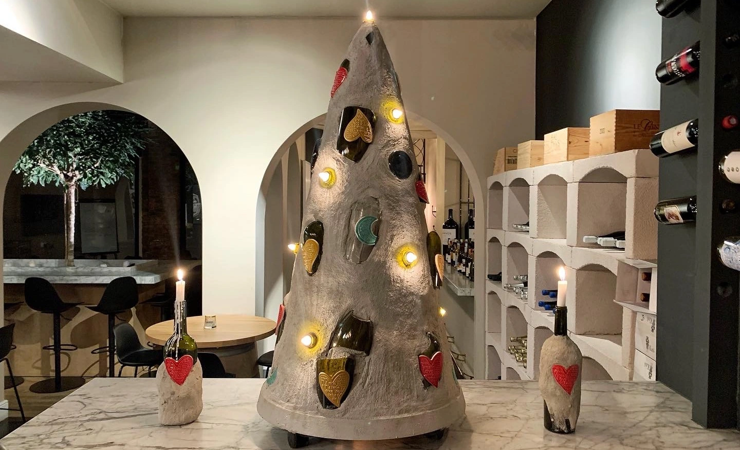Concrete christmas with broken wine bottles and lights